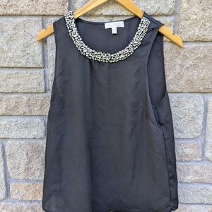 Elegant Black Sleeveless Top with Embellished Neckline
